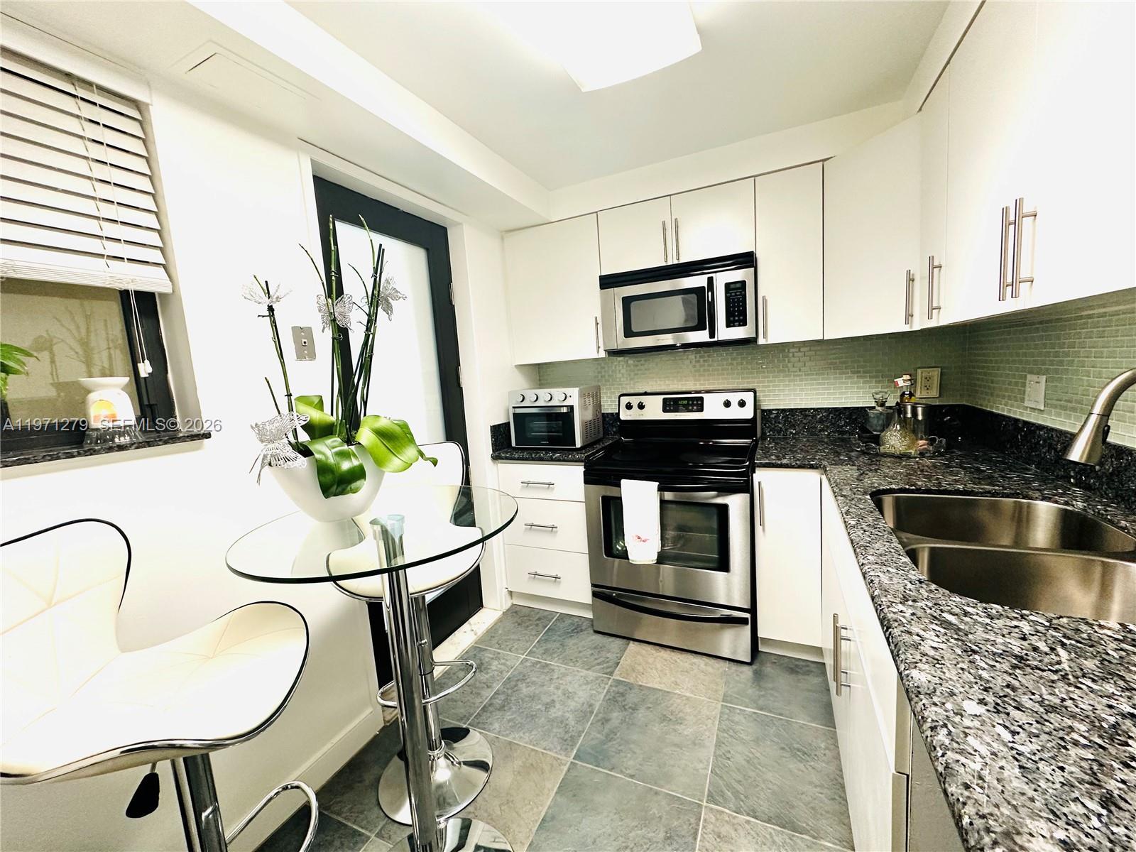 301 Golden Isles Dr (Avail MAY,1) # 114, Hallandale Beach FL 33009 photo 4
