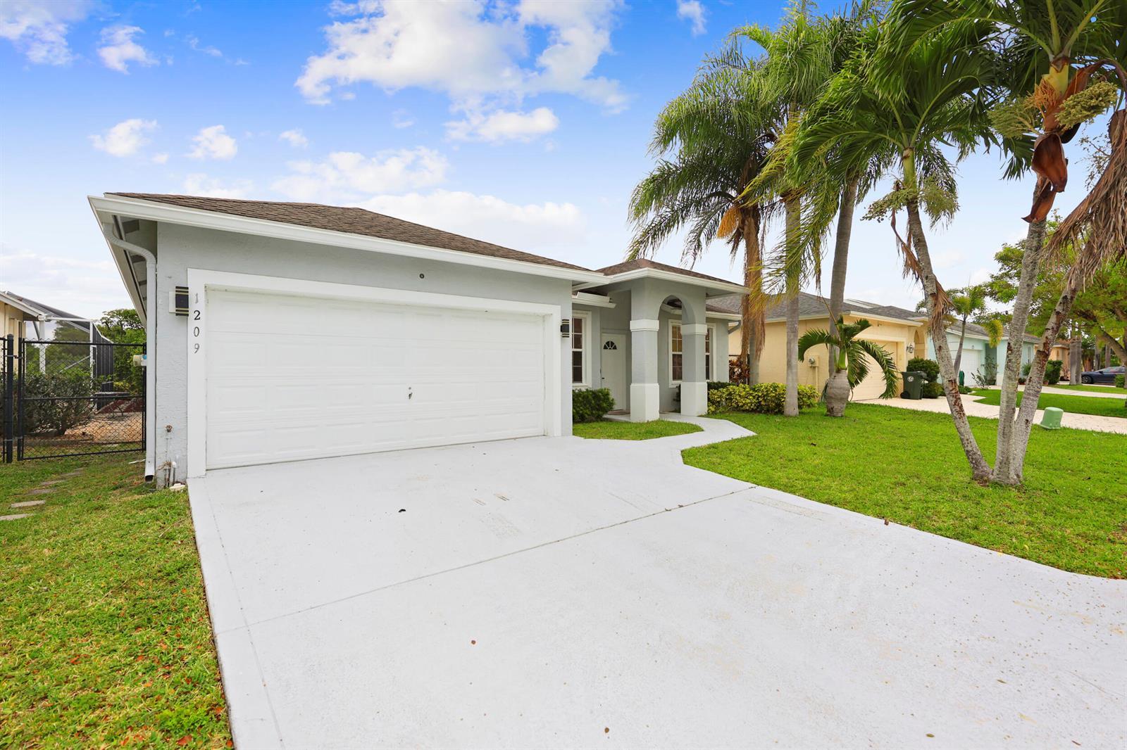 1209 Olympic Circle, FL 33413 photo 2