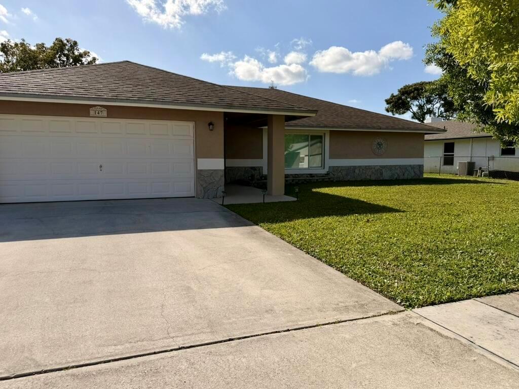 147 Sunflower Circle, Royal Palm Beach FL 33411