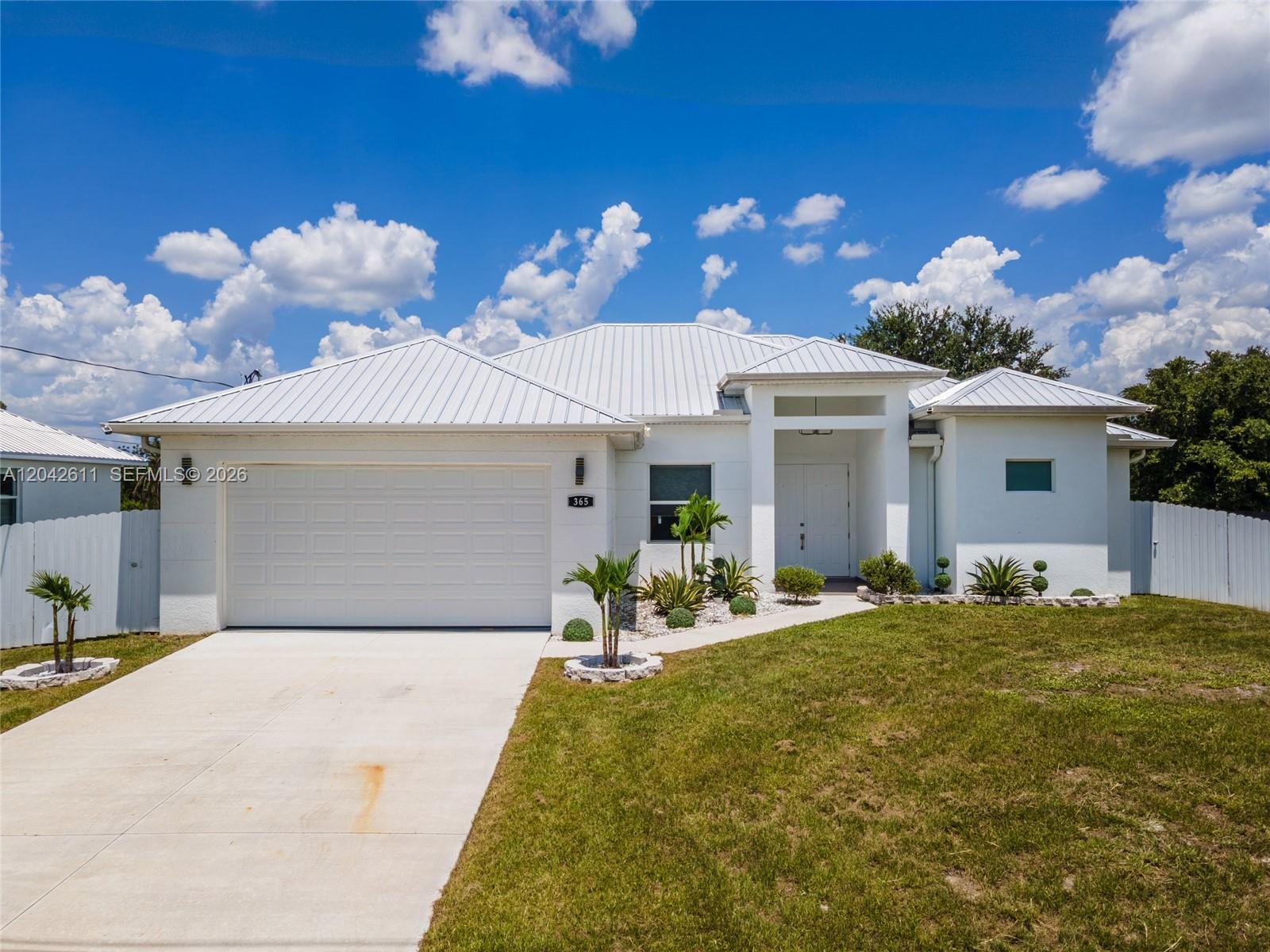365 Ranier Ave, Lehigh Acres FL 33974 photo 2