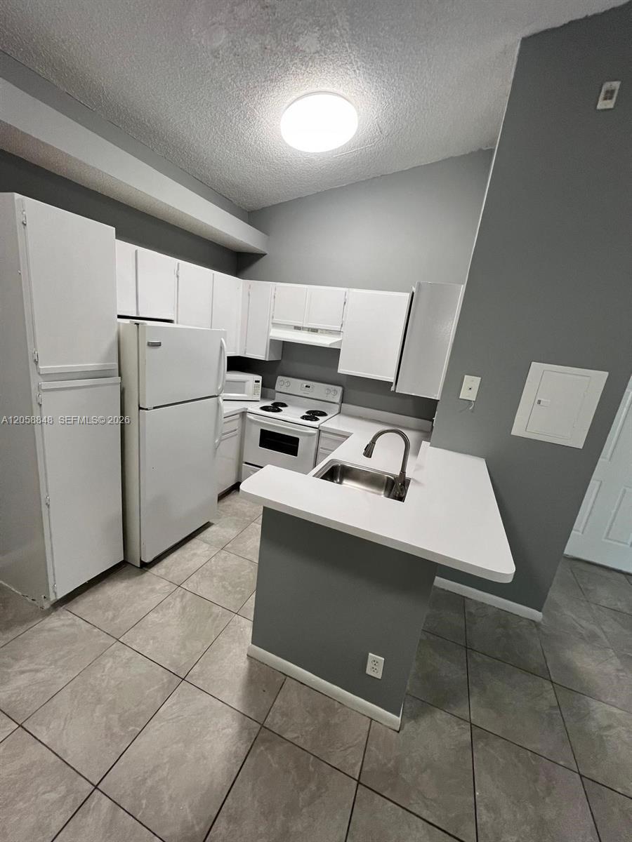 631 Lyons Rd # 12201, Coconut Creek FL 33063 photo 2