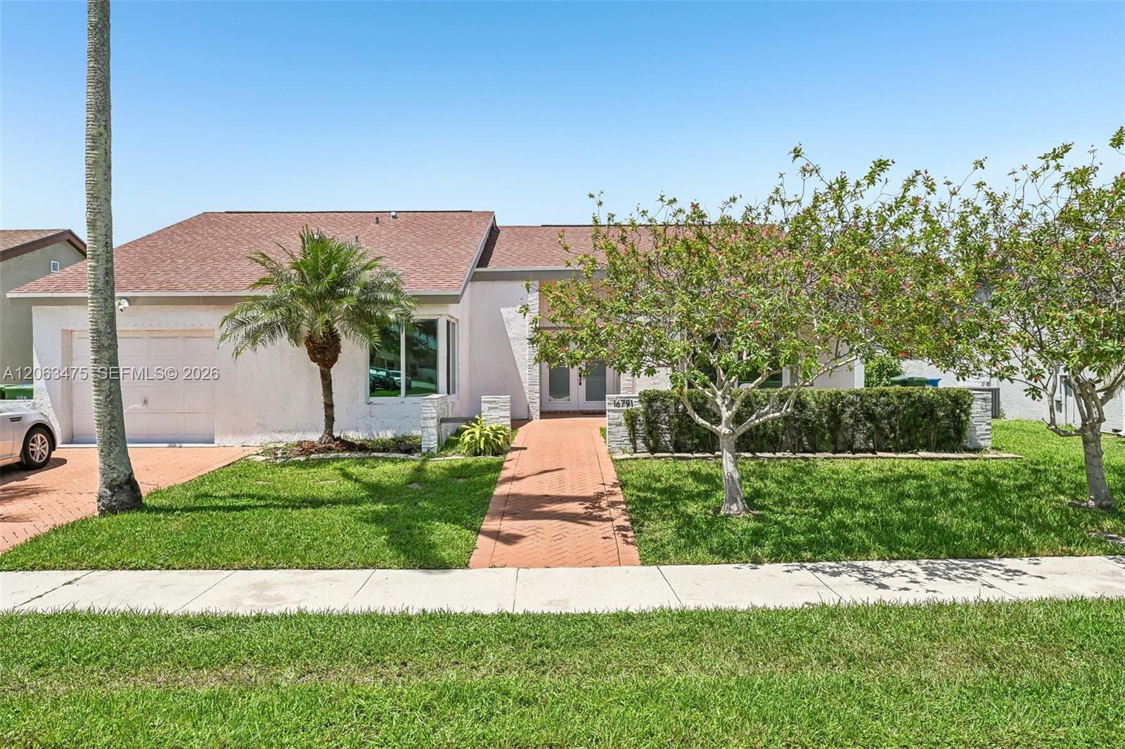 16791 Royal Poinciana Dr, Weston FL 33326