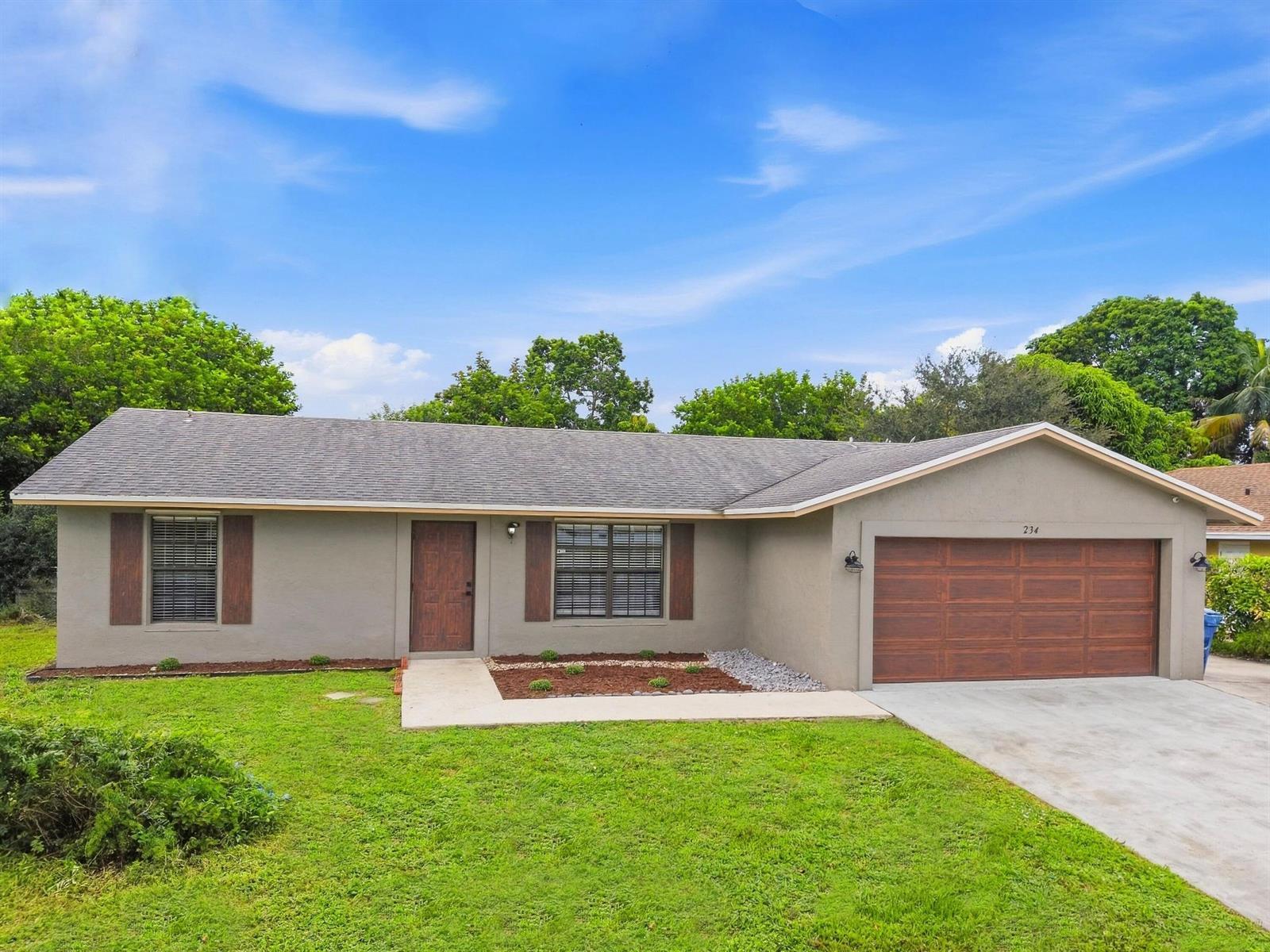 234 La Mancha Avenue, Royal Palm Beach FL 33411