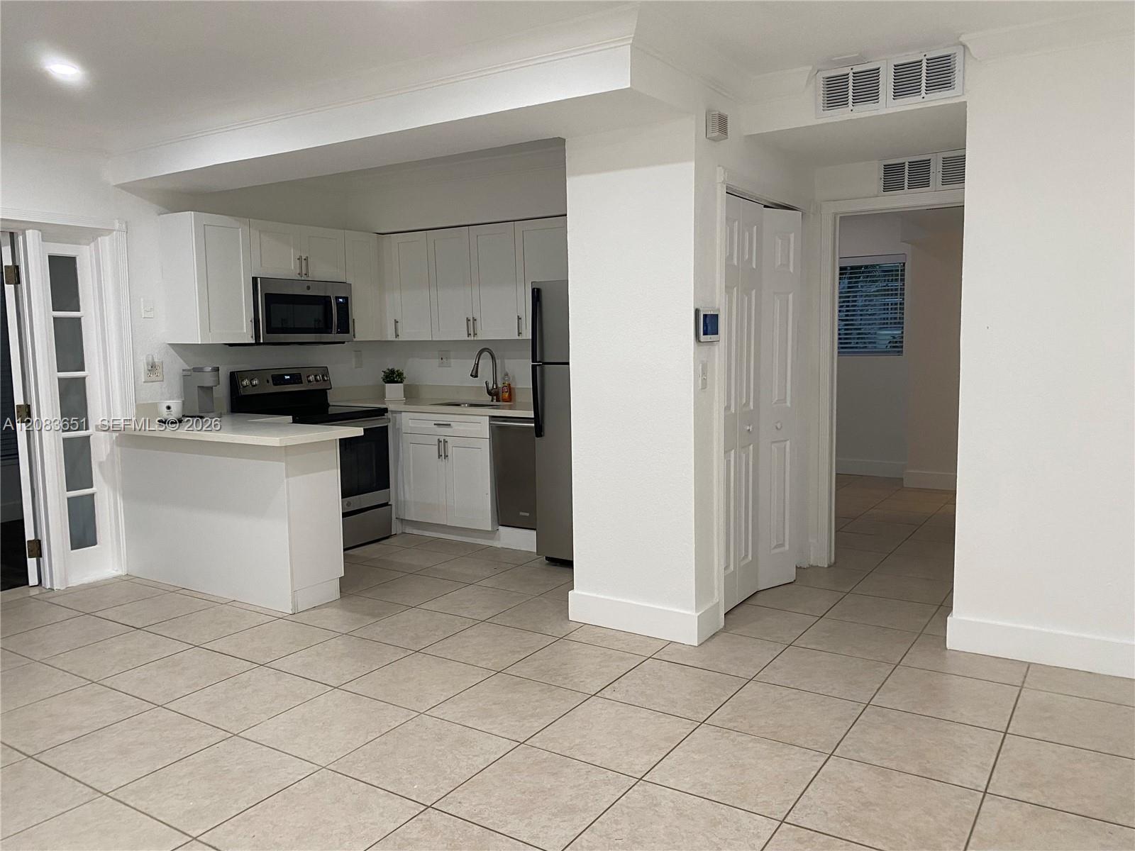 1 Edgewater Dr + DEN # 103, Coral Gables FL 33133